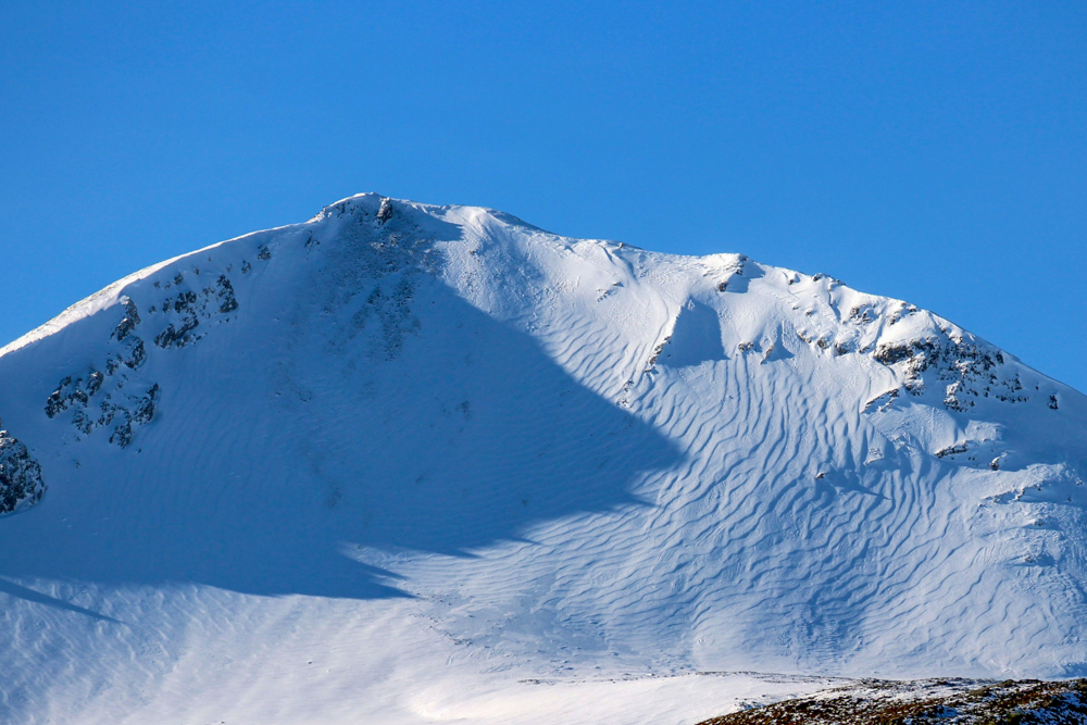 Snowy peak and ridge of Beinn Eighe