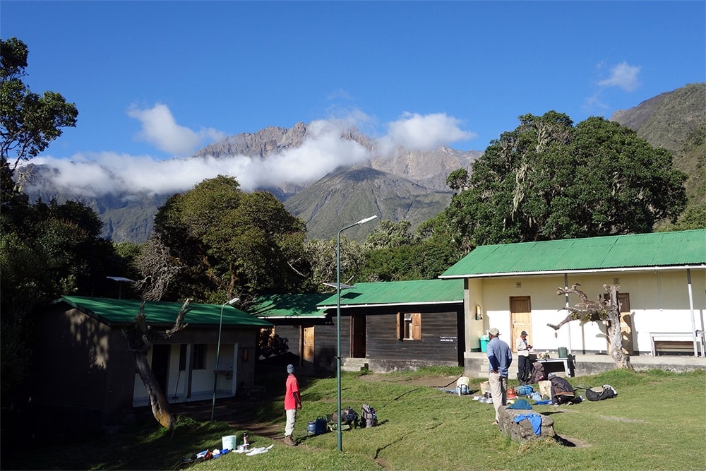 Mountain huts with the summit behind