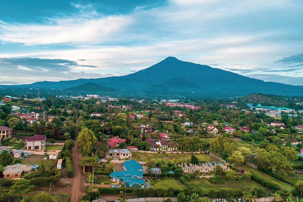 Mt Meru with a small town and farmland in the foreground