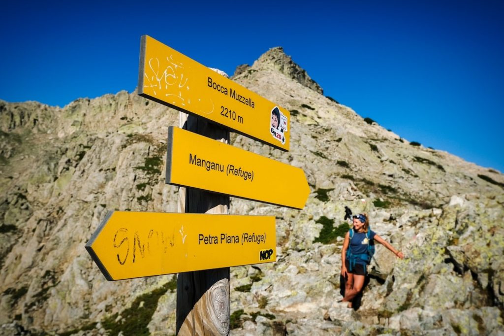 yellow trail signs along the GR20 in Corsica