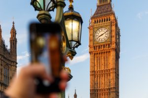Someone takes a smartphone photo of Big Ben in London, UK