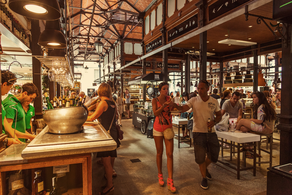 Tourists visiting the famous San Miguel Market in Madrid